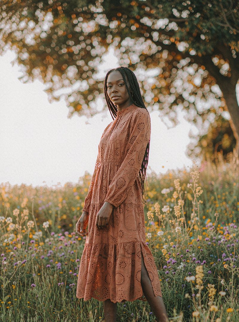 Marigold Lace Midi Dress — Terracotta, modelled outdoors