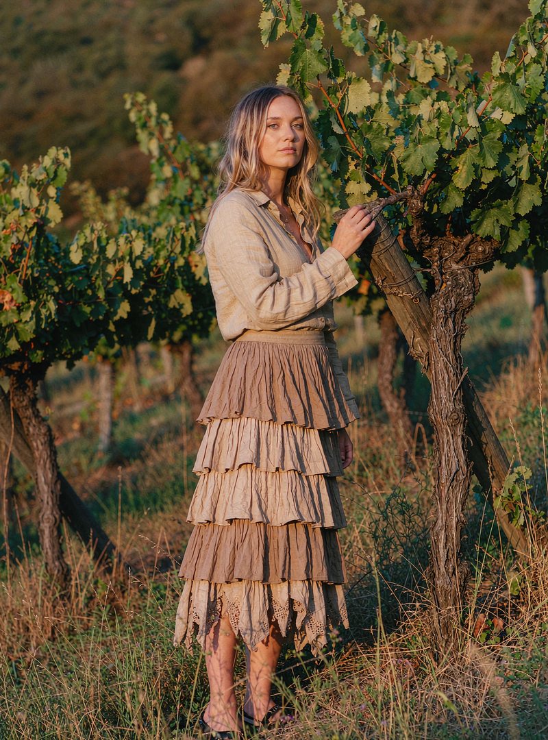 Ines Tiered Midi Skirt — Light Sand, modelled outdoors