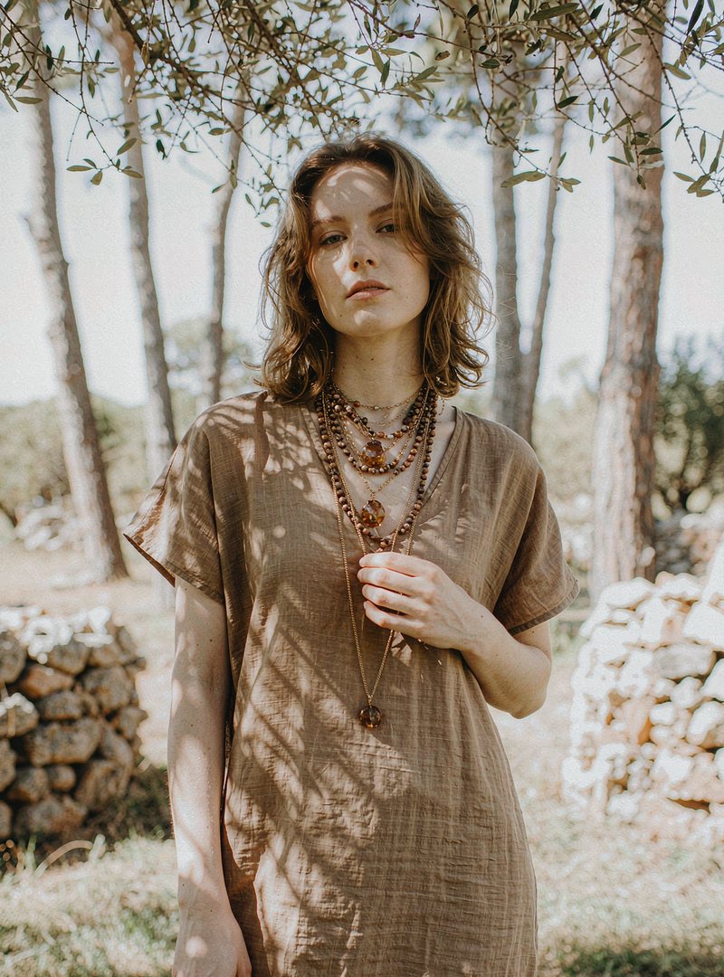 Amber Beaded Necklace — Gold, modelled outdoors