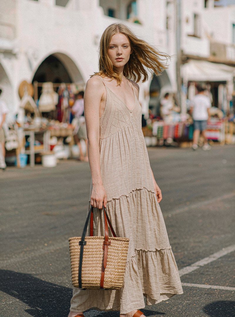 Rattan Market Tote — Natural, modelled outdoors