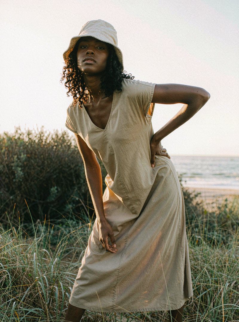 Solstice Linen Bucket Hat — Ecru, modelled outdoors